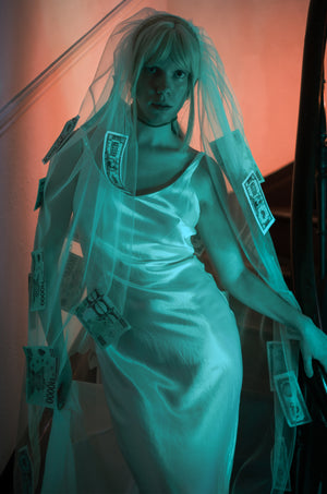 Veiled promise bias cut bridal dress